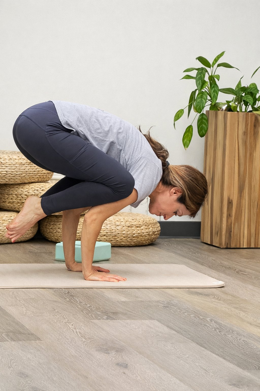 Azadeh — crow pose in studio